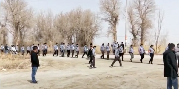 Shackled and Blindfolded Men in Xinjiang, China